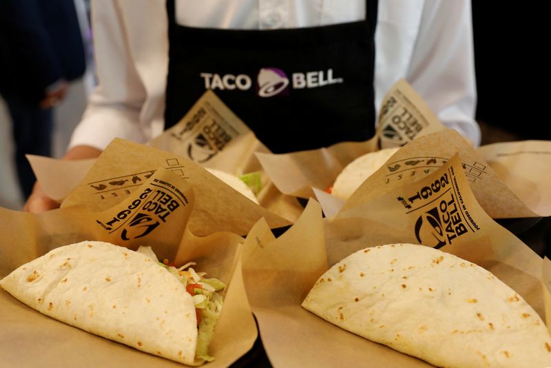 FILE PHOTO: A server holds food during the opening ceremony of a Taco Bell restaurant in Bangkok, Thailand January 22, 2019. REUTERS/Soe Zeya Tun/ File Photo