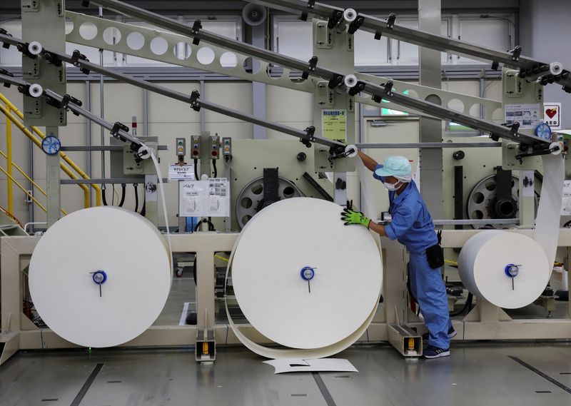 An employee works on an adult diaper production line at a factory of Daio Paper Corporation's subsidiary Elleair in Fujinomiya, Shizuoka prefecture, Japan June 18, 2024. REUTERS/Kim Kyung-Hoon
