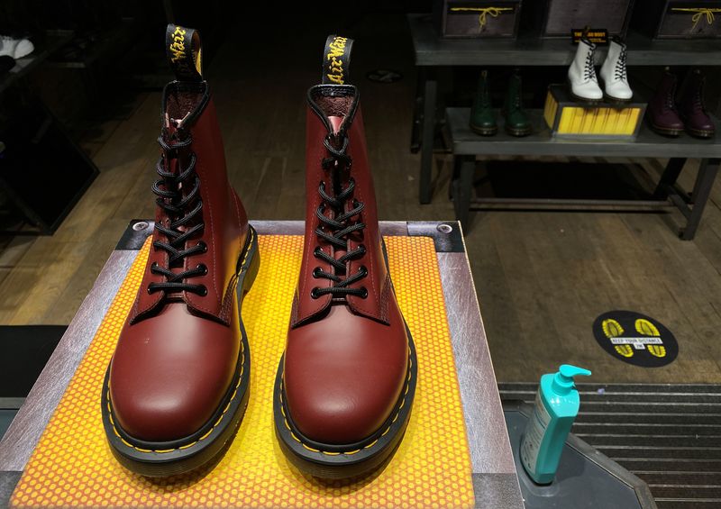 A pair of Dr. Martens boots is seen through the window of a Dr Martens shop in London, Britain, September 17, 2020. REUTERS/Simon Newman