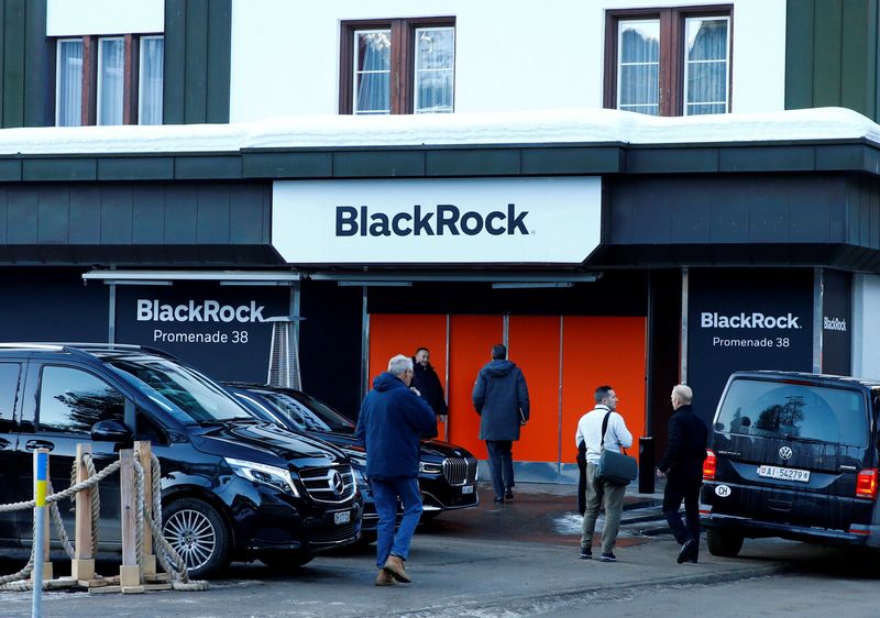FILE PHOTO: People are seen in front of a showroom that hosts BlackRock in Davos, Switzerland Januar 22, 2020.  REUTERS/Arnd Wiegmann/File Photo