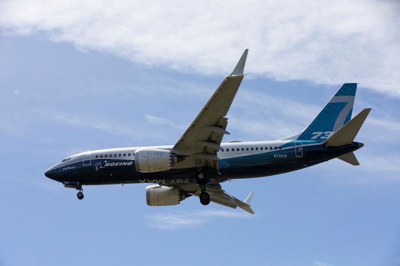 FILE PHOTO: A Boeing 737 MAX airplane lands after a test flight at Boeing Field in Seattle, Washington, U.S. June 29, 2020. REUTERS/Karen Ducey/File Photo