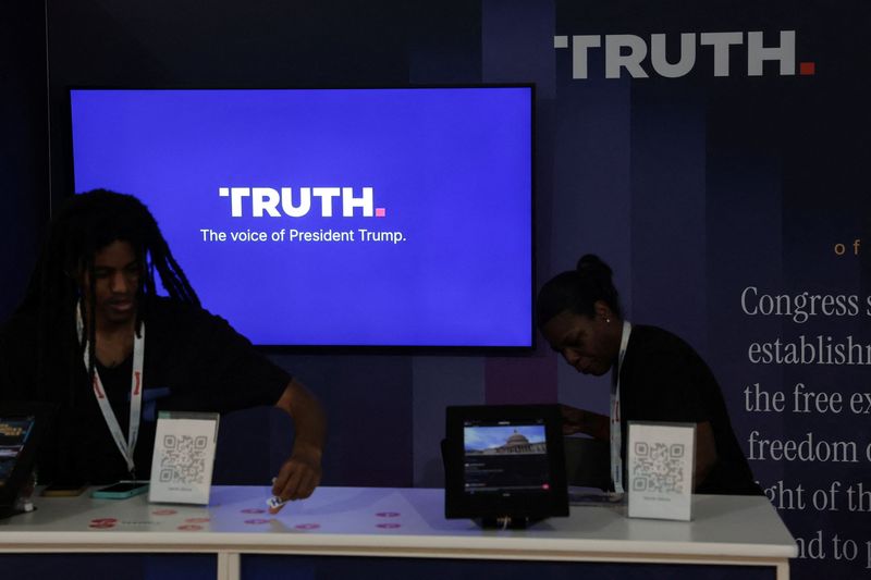 Workers straighten the Truth Social booth at the Great American State Fair celebrating the 250th anniversary of U.S. independence in Washington, D.C., U.S., July 2, 2026. REUTERS/Jonathan Ernst