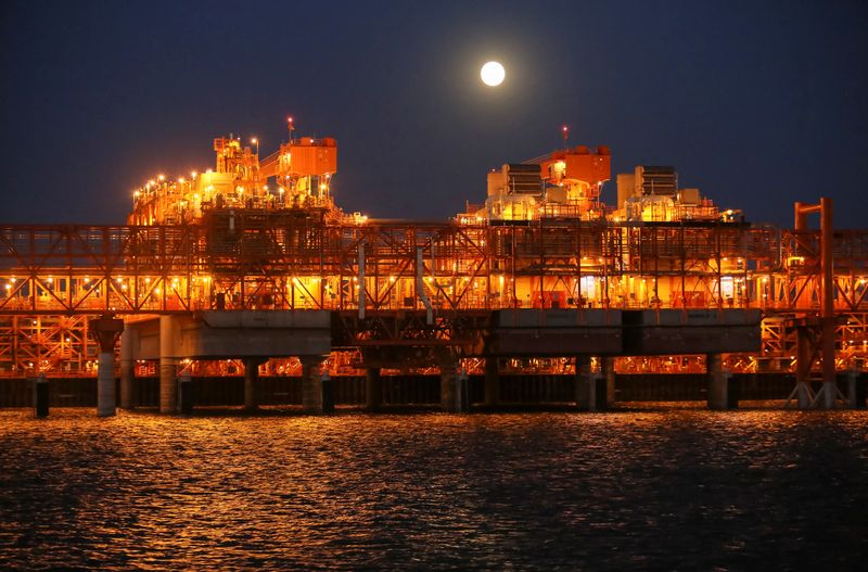 The full moon rises in the background over the infrastructure on D Island, the main processing hub, at the Kashagan offshore oil field in the Caspian sea in western Kazakhstan August 21, 2013. REUTERS/Stringer/
