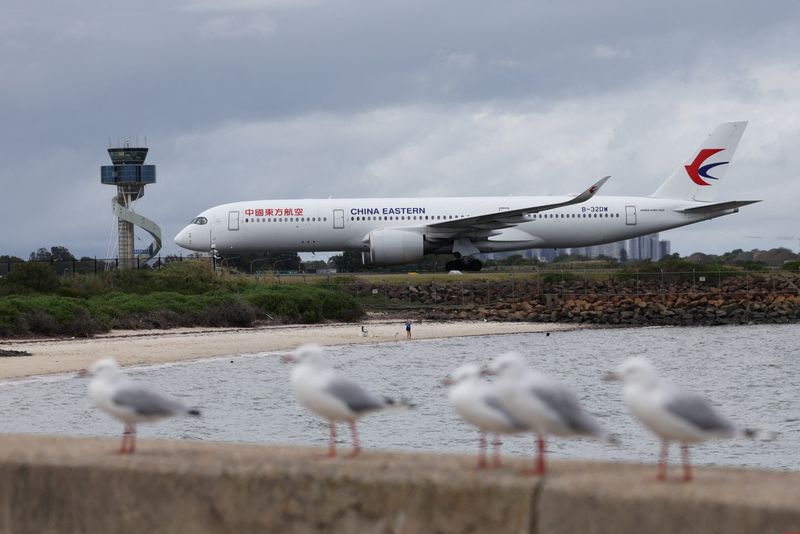 FILE PHOTO: A China Eastern aeroplane taxis along a runway at Sydney Airport in Sydney, Australia, February 26, 2026. REUTERS/Hollie Adams/File Photo