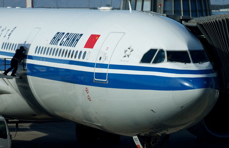 FILE PHOTO: An Air China plane is seen at the international airport in Beijing, China October 19, 2023. REUTERS/Edgar Su/File Photo