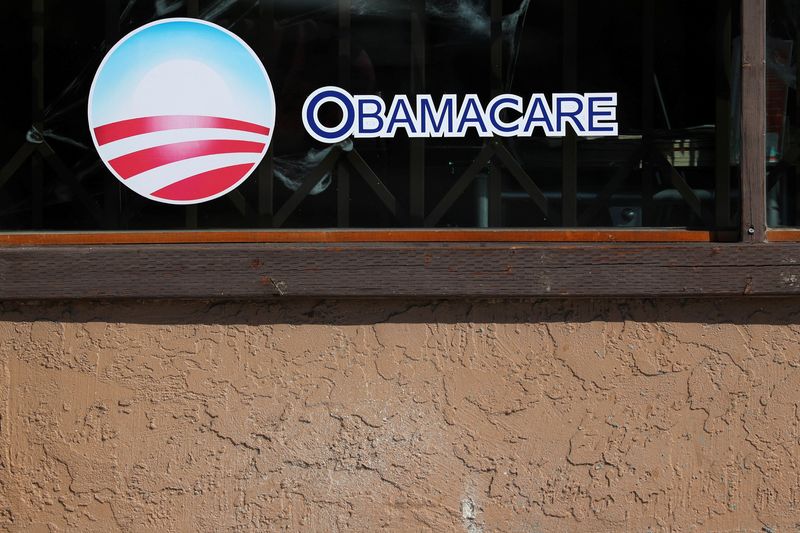 File Photo: A sign on an insurance store advertises Obamacare in San Ysidro, San Diego, California, U.S., October 26, 2017. REUTERS/Mike Blake/File Photo