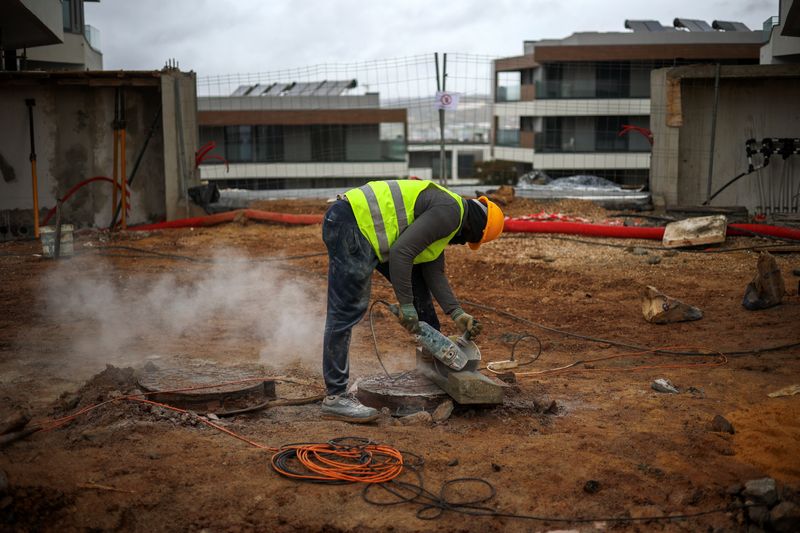 A man works on a construction site in Lisbon, Portugal, November 24, 2025. REUTERS/Pedro Nunes