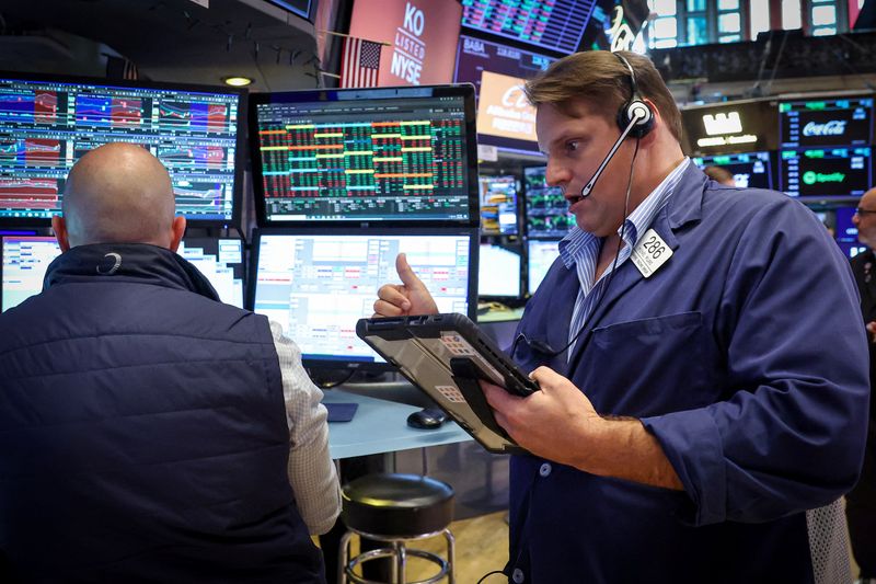 Traders work on the floor at the New York Stock Exchange (NYSE) in New York City, U.S., July 20, 2026.  REUTERS/Brendan McDermid