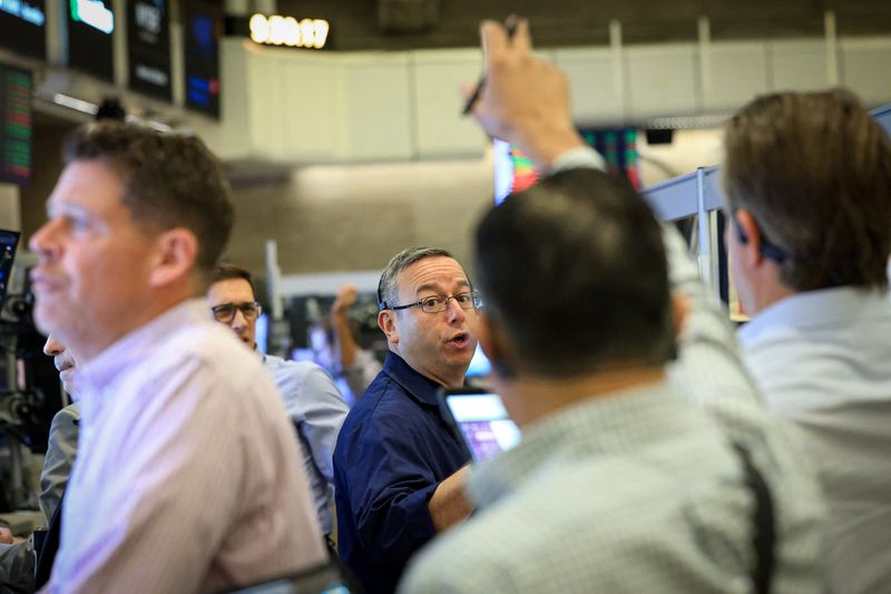 Futures-options traders work on the floor at the New York Stock Exchange's NYSE American (AMEX) in New York City, U.S. July 20, 2026.  REUTERS/Brendan McDermid