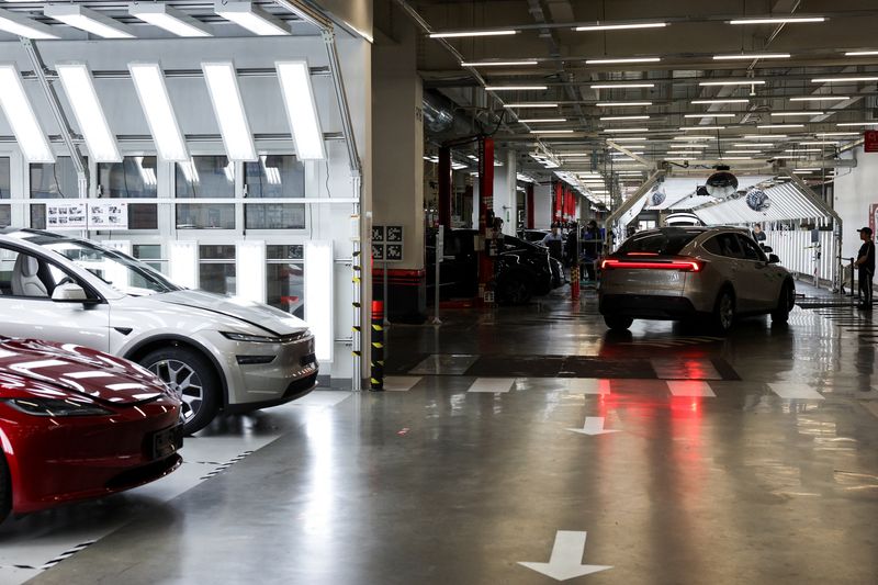 FILE PHOTO: Tesla cars line up for inspection at the Tesla Gigafactory during a government‑organised media trip in Shanghai, China, April 14, 2026. REUTERS/Go Nakamura/File Photo