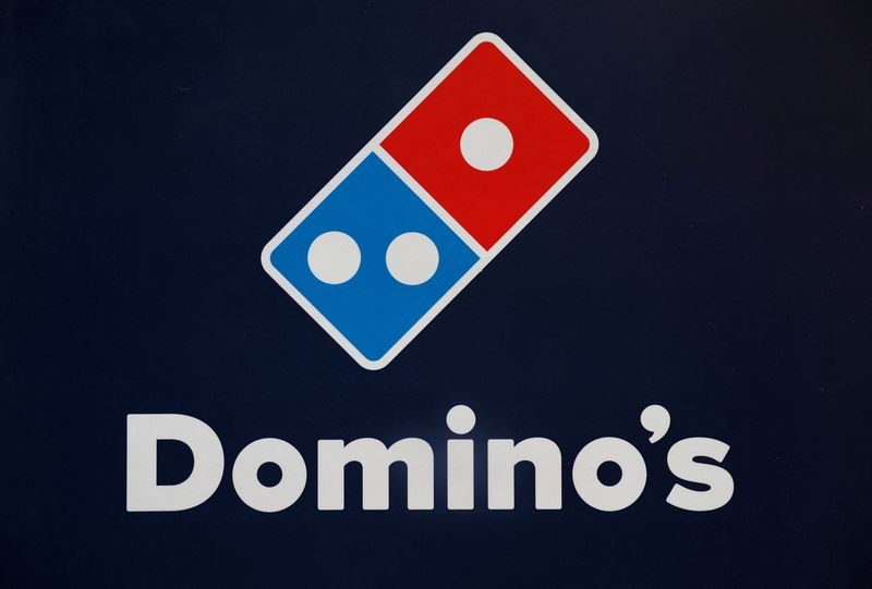 FILE PHOTO: A Domino's pizza logo is pictured inside a restaurant in Noida, India, July 4, 2023. REUTERS/Adnan Abidi/File Photo