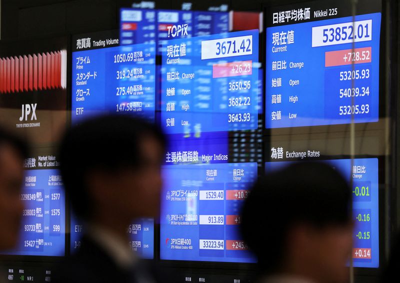 Visitors walk past screens displaying current market information at Japan Exchange Group's Tokyo Stock Exchange in Tokyo, Japan, April 6, 2026. REUTERS/Issei Kato