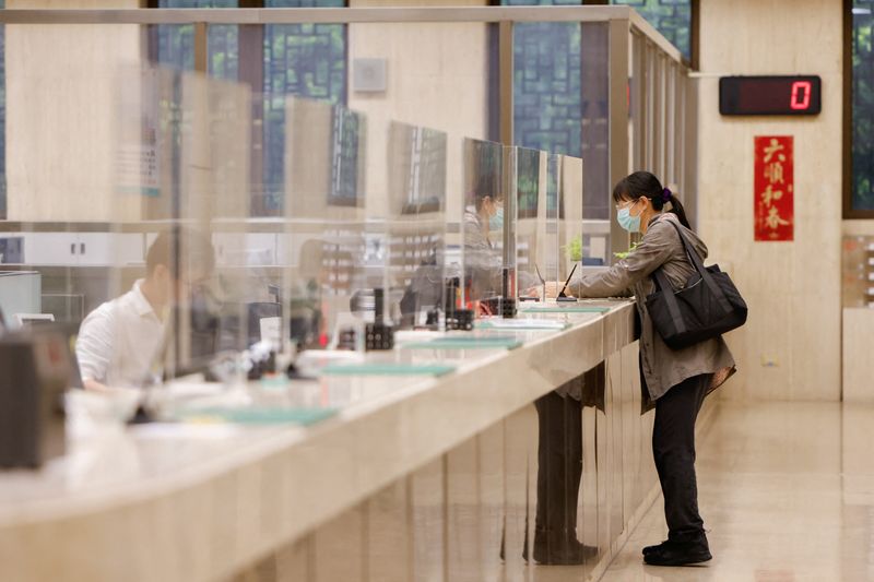 A woman stands inside Taiwan's central bank in Taipei, Taiwan May 29, 2025. REUTERS/Ann Wang/File Photo