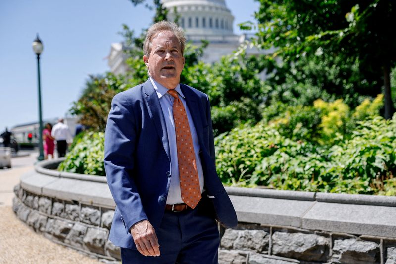 FILE PHOTO: Texas Attorney General Ken Paxton walks outside the U.S. Capitol building on Capitol Hill, in Washington, D.C., U.S., June 3, 2026. REUTERS/Kylie Cooper/File Photo