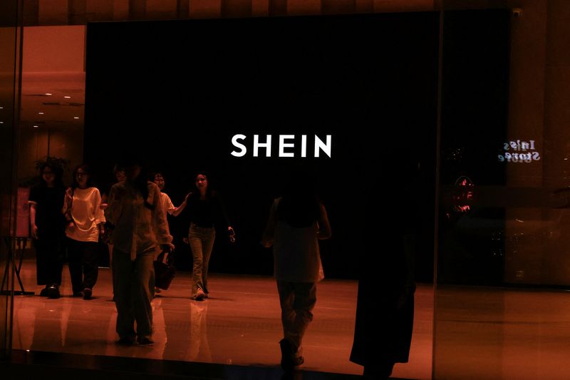People walk inside of the Shein office building in Guangzhou, Guangdong province, China April 16, 2025. REUTERS/Tingshu Wang
