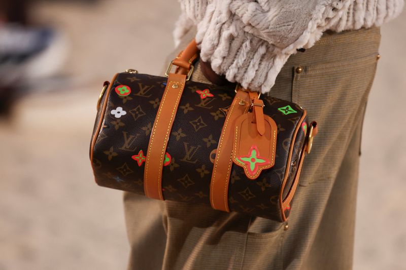 FILE PHOTO: A model presents a creation by designer and musician Pharrell Williams as part of his Menswear Spring-Summer 2027 collection show for fashion house Louis Vuitton during Men's Fashion Week in Paris, France, June 23, 2026. REUTERS/Gonzalo Fuentes/File Photo