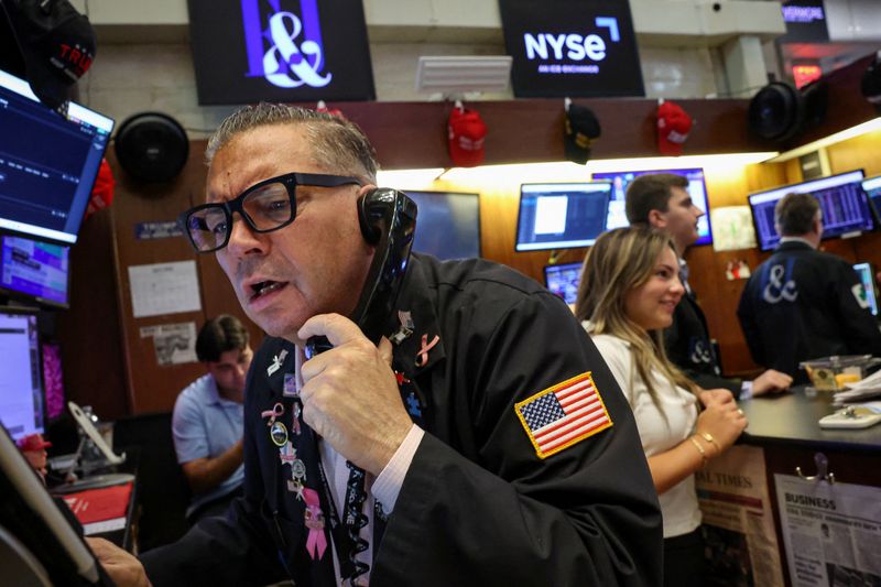 Traders work on the floor at the New York Stock Exchange (NYSE) in New York City, U.S., July 23, 2026.  REUTERS/Brendan McDermid