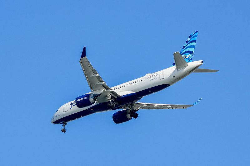 A JetBlue Airlines plane approaches Ronald Reagan Washington National Airport near Alexandria, Virginia, U.S., December 24, 2025. REUTERS/Ken Cedeno