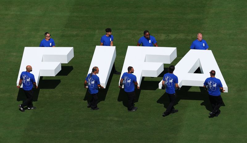 Soccer Football - FIFA World Cup 2026 - Final - Spain v Argentina - New York/New Jersey Stadium, East Rutherford, New Jersey, U.S. - July 19, 2026 Pitch staff carry the FIFA logo on the pitch before the match REUTERS/Mike Segar