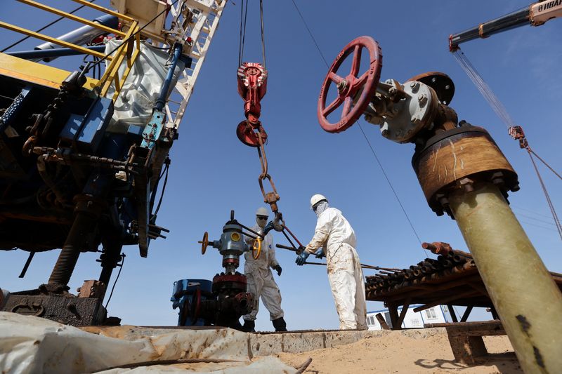 Specialists work at a drilling rig at the Airankol oil field operated by Caspiy Neft in the Atyrau region, Kazakhstan, April 20, 2026. REUTERS/Pavel Mikheyev