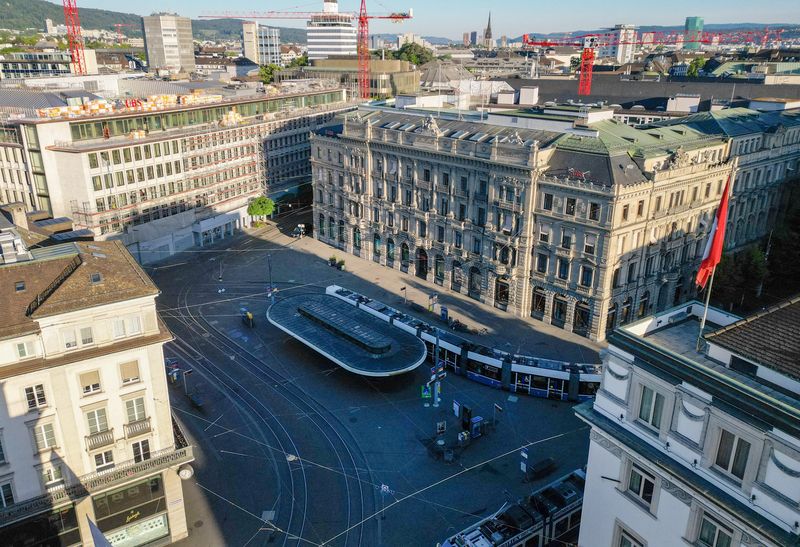 A drone view shows trams arriving at the Paradeplatz and the Swiss bank UBS building in Zurich, Switzerland, May 24, 2026. REUTERS/Denis Balibouse