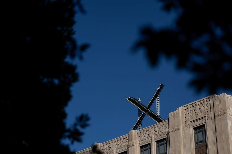 'X' logo is seen on the top of the headquarters of the messaging platform X, formerly known as Twitter, in downtown San Francisco, California, U.S., July 30, 2023. REUTERS/Carlos Barria