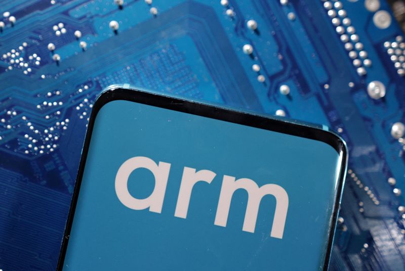 A smartphone with a displayed Arm Ltd logo is placed on a computer motherboard in this illustration taken March 6, 2023. REUTERS/Dado Ruvic/Illustration