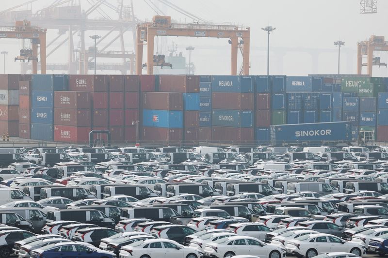 KIA vehicles for export, and containers, as South Korean Trade Minister Yeo Han-koo visits an automobile logistics hub at Pyeongtaek port to check export and import operations, amid the U.S.-Israeli conflict with Iran, in Pyeongtaek, South Korea, April 3, 2026. REUTERS/Kim Soo-hyeon