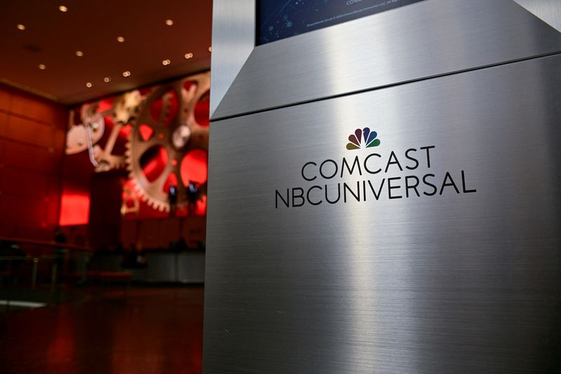 FILE PHOTO: A view shows a signage of Comcast and NBC Universal in the lobby of the corporate headquarters of Comcast in Philadelphia, Pennsylvania, U.S. November 20, 2024. REUTERS/Bastiaan Slabbers/ File Photo