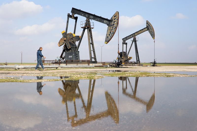 A man walks next to pumpjacks, in Rmelan, Syria, February 9, 2026. REUTERS/Orhan Qereman