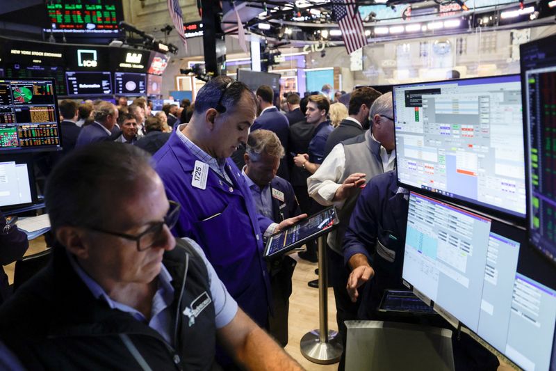 Traders work on the floor of the New York Stock Exchange (NYSE) in New York City, U.S., July 30, 2026. REUTERS/Jeenah Moon