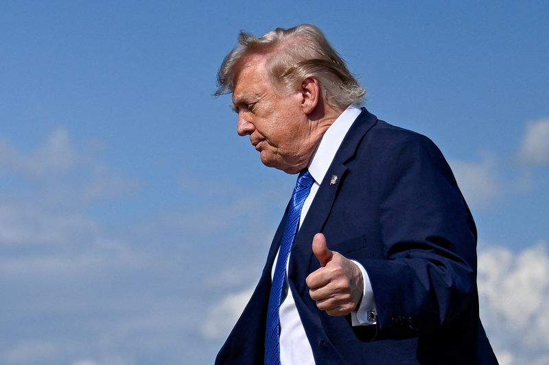 FILE PHOTO: U.S. President Donald Trump gives thumbs-up as he walks to board Marine One following his arrival aboard Air Force One at Morristown Municipal Airport in Morristown, New Jersey, U.S., July 31, 2026. REUTERS/Daniel Heuer/File Photo