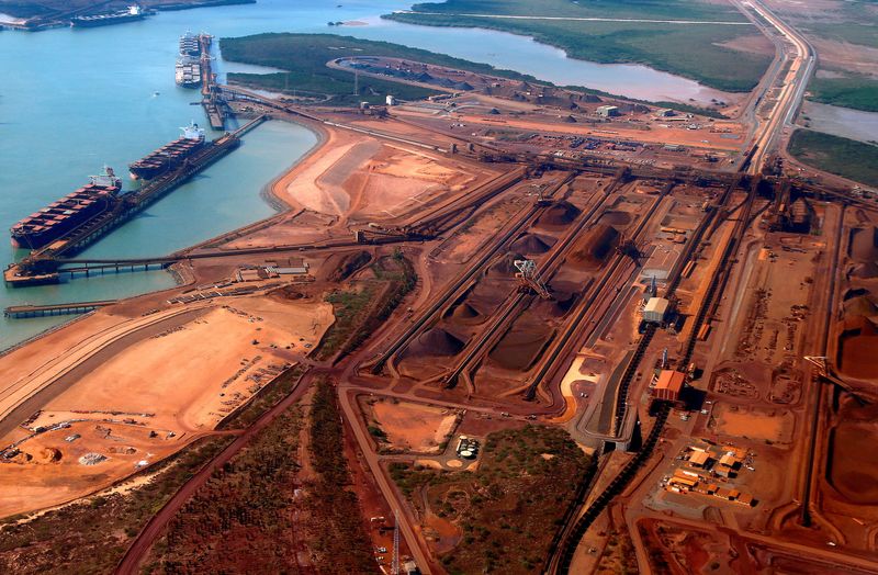 FILE PHOTO: Ships waiting to be loaded with iron ore can be seen at Port Hedland in the Pilbara region of Western Australia December 3, 2013.  REUTERS/David Gray/File Photo
