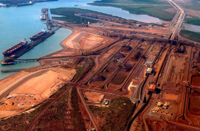 FILE PHOTO: Ships waiting to be loaded with iron ore can be seen at Port Hedland in the Pilbara region of Western Australia December 3, 2013.  REUTERS/David Gray/File Photo