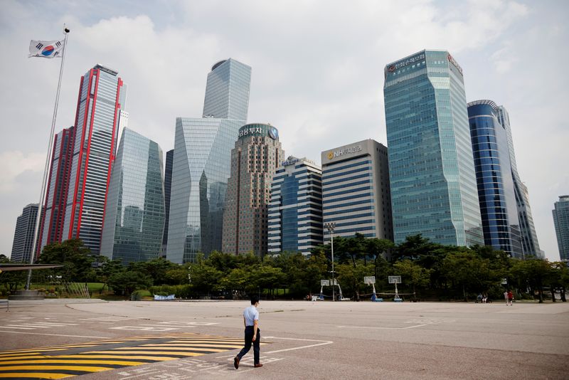 An employee walks at an empty park near a financial district in Seoul, South Korea, September 10, 2020.   REUTERS/Kim Hong-Ji