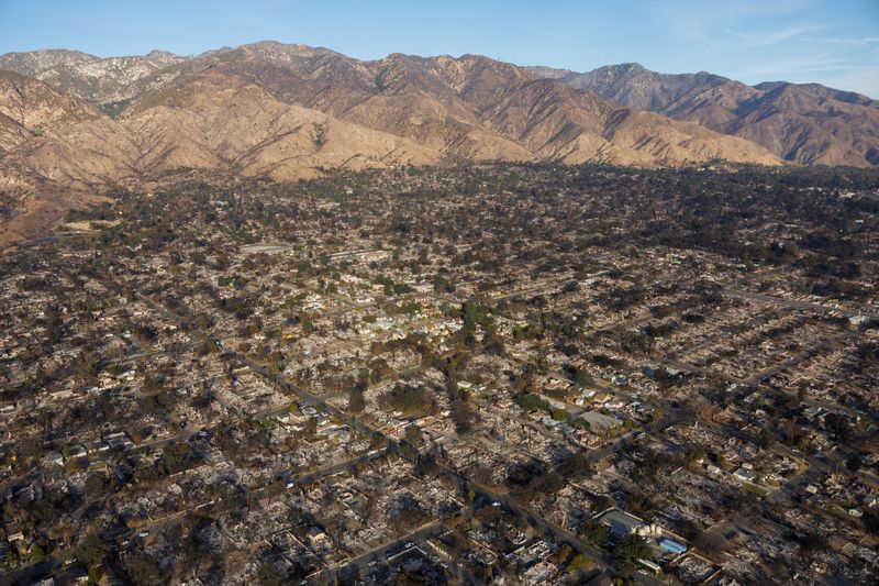 FILE PHOTO: An aerial view of the fire damage caused by the Eaton Fire is shown in Altadena, California, U.S. January 22, 2025.  REUTERS/Mike Blake/File Photo