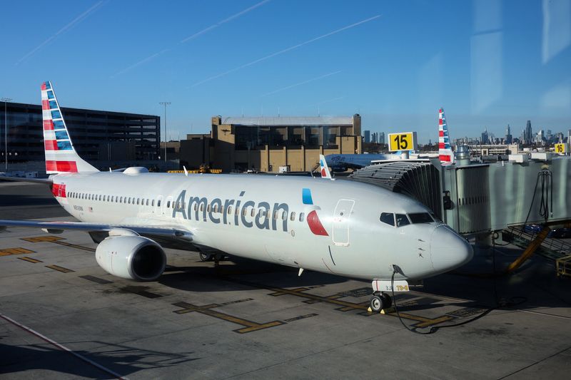 An American Airlines plane is parked at a gate at the LaGuardia Airport in New York City, U.S., November 18, 2025. REUTERS/Kylie Cooper