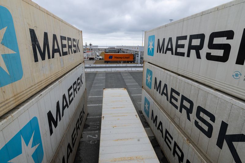 Trucks ply on roads near refrigerated Maersk containers at APM Terminals at the Port of Los Angeles, California, U.S., March 4, 2026.   REUTERS/Mike Blake