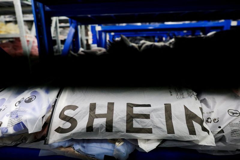FILE PHOTO: Packs of clothing are displayed at a garment factory for Shein in Panyu District, Guangzhou, Guangdong province, China, July 27, 2026. REUTERS/Go Nakamura/File Photo