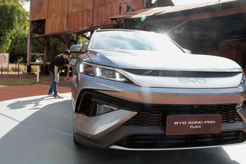 FILE PHOTO: A person looks at a BYD Song Pro Flex vehicle during the launch of the Chinese automaker's first Brazilian-made plug-in hybrid flex-fuel car at the Museu da Cana in Sertaozinho, Sao Paulo state, Brazil, August 4, 2026. REUTERS/Joel Silva/File Photo