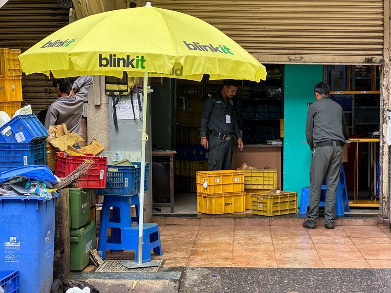 Plastic crates and garbage are placed outside a Blinkit store as cleaning and pest control operations are carried out after Maharashtra's Food and Drug Administration (FDA) inspectors found food safety and hygiene violations, leading to the suspension of the store's food licence, in Mumbai, India, August 15, 2026. REUTERS/Francis Mascarenhas