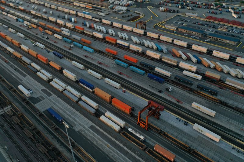 FILE PHOTO: An aerial view of shipping containers and freight railway trains at the Union Pacific Los Angeles (UPLA) Intermodal Facility rail yard in Commerce, California, U.S., September 15, 2022. REUTERS/Bing Guan/File Photo