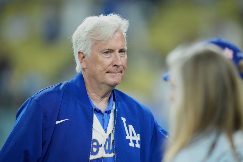 Mar 26, 2026; Los Angeles, California, USA; Los Angeles Dodgers owner and chairman Mark Walter walks on the field after the game against the Arizona Diamondbacks at Dodger Stadium. Mandatory Credit: Kirby Lee-Imagn Images