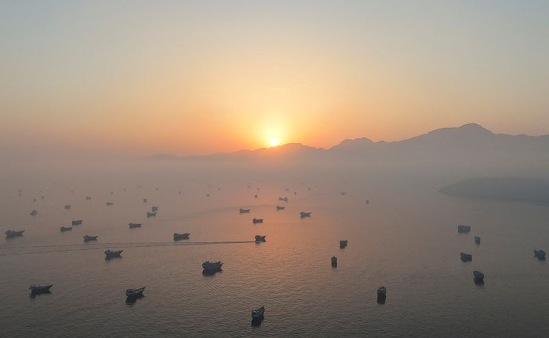 FILE PHOTO: A drone view shows vessels in the Strait of Hormuz, as seen from Musandam, Oman, June 15, 2026. REUTERS/Stringer/File Photo
