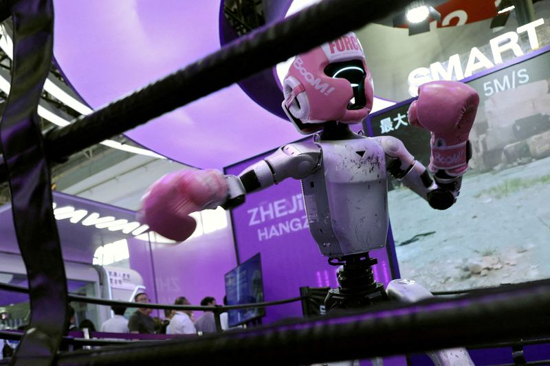 FILE PHOTO: A Unitree humanoid robot demonstrates kickboxing moves at the booth on Zhejiang province during the China International Supply Chain Expo (CISCE) in Beijing, China June 22, 2026. REUTERS/Florence Lo/File Photo