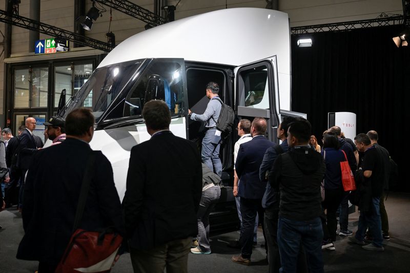 Visitors queue to enter the Tesla Semi truck, a fully electric semi-trailer truck, at the booth of the U.S. carmaker at the IAA truck show in Hanover, Germany, September 17, 2024. REUTERS/Fabian Bimmer