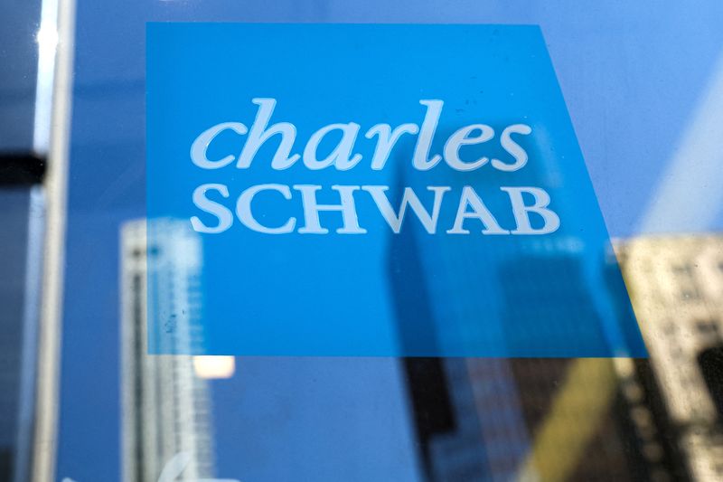 The company logo for Financial broker Charles Schwab is displayed at a location in the financial district in New York, U.S., March 20, 2023.  REUTERS/Brendan McDermid
