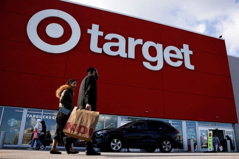 FILE PHOTO: People exit and arrive at a Target store on Black Friday in Brooklyn, New York, U.S., November 29, 2024. REUTERS/Brendan McDermid/File Photo
