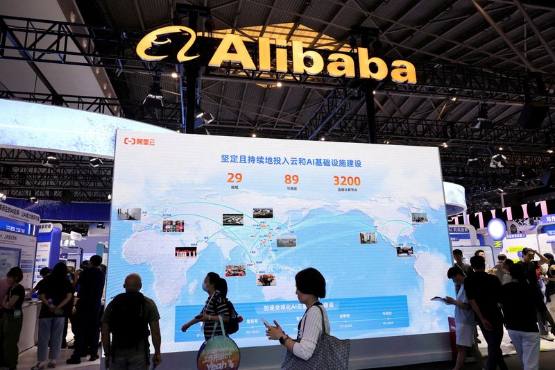 FILE PHOTO: FILE PHOTO: People visit an Alibaba booth during the World Artificial Intelligence Conference in Shanghai, China July 26, 2025.  REUTERS/Go Nakamura/File Photo/File Photo