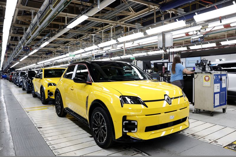 An employee works at the automotive assembly line for the electric Renault R5 E-Tech car at the Renault factory of the Ampere ElectriCity site in Douai, France, July 15, 2026. REUTERS/Benoit Tessier